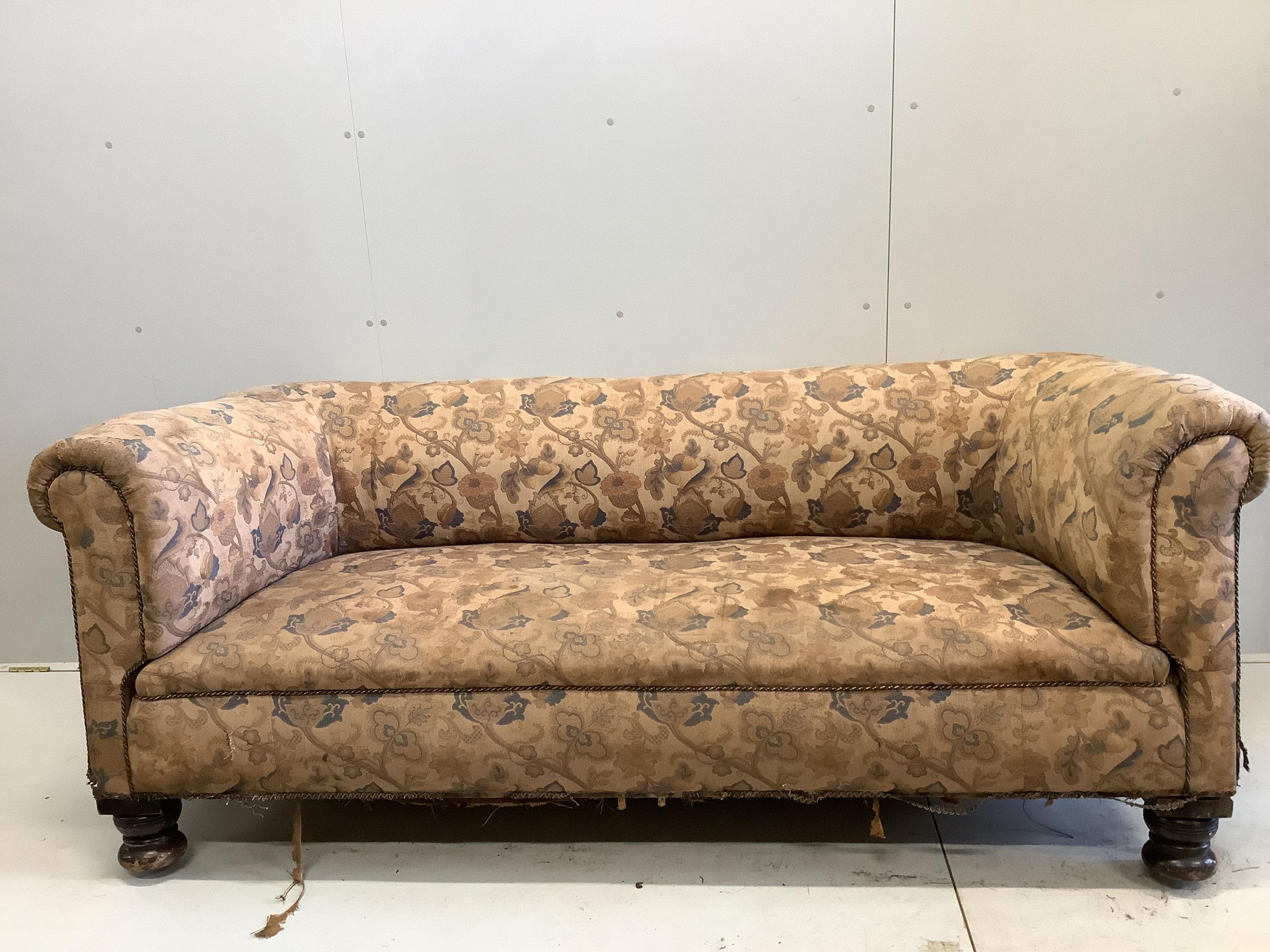 An early 20th century Chesterfield settee, width 208cm, depth 84cm, height 84cm. Condition - poor